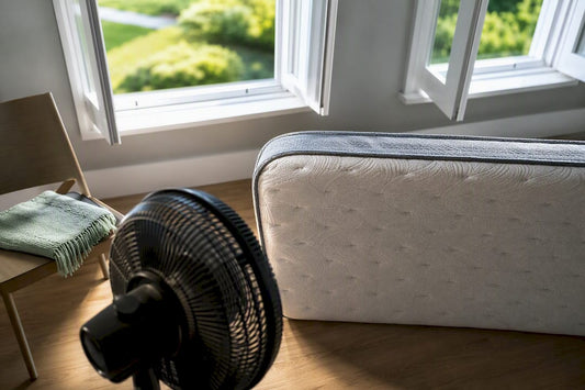 Mattress edge airing beside open windows