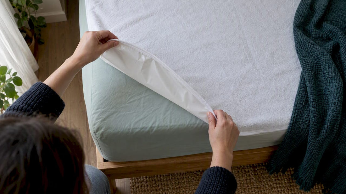 Flexible mattress protector over bed